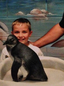Patrick meets a penguin at the Georgia Aquarium.